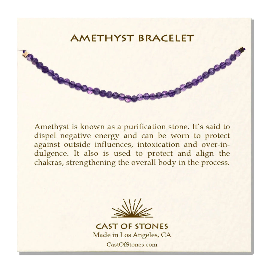 A cream, Cast of Stones-branded backing card holds a crystal-beaded bracelet labelled "Amethyst Bracelet". There is an informational paragraph below the bracelet detailing the properties of the crystal and its benefits.