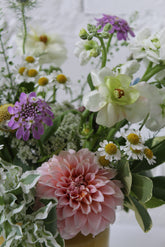 Close up of a floral arrangement in soft neutral colors. 