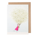 White card with a watercolor painting of a small woman carrying an oversized bouquet of baby's breath.