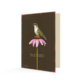 Black card with a hummingbird atop a pink coneflower. The text below reads "Blessed".