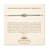A cream, Cast of Stones branded backing card holds a crystal-beaded bracelet labelled "Calming and Anti-Anxiety Bracelet". There is an informational paragraph below the bracelet detailing the properties of each crystal and its benefits.