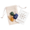 Beige pouch with green adventurine, sodalite, and citrine lying on top of it. A card with the Cast of Stones logo and the text "Confidence & Success Crystals and Stones" sits next to it against a white background.