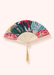 Colorful, tropical-patterned hand fan with a gold tassel on a white background