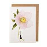 White card with a watercolor painting of a small man carrying an oversized light pink hellebore. 