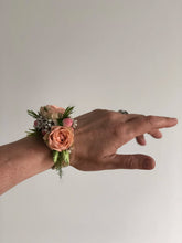 Corsage in peach colored flowers