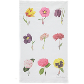 A white tea towel featuring a printed grid of nine colorful flowers, including tulips, poppies, and hydrangeas, with tiny figures standing beside each bloom. 