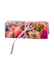 Rolled up pink jewelry roll with a floral pattern in pink, purple and reens, tied with a lavender ribbon.