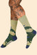Pair of men's socks with golf imagery wrapped around them. 