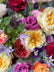 Close up shot of bright, colorful flowers that make up a funeral arrangement. 