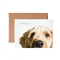 White greeting card with a dog's face 3/4 in frame, with the words "Thinking of you".