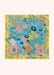 Colorful blue and yellow floral-patterned bandana on a white background.