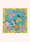 Colorful blue and yellow floral-patterned bandana on a white background.