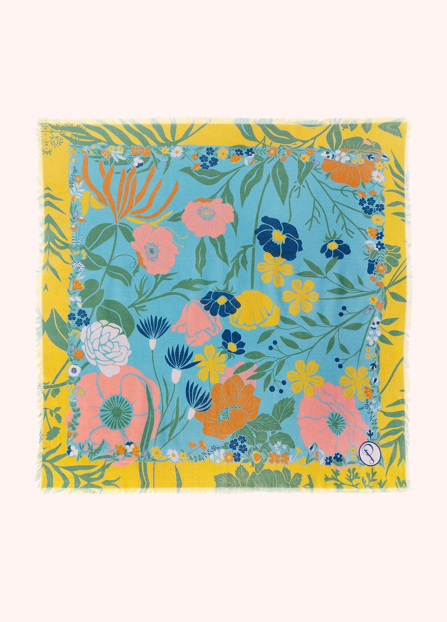 Colorful blue and yellow floral-patterned bandana on a white background.