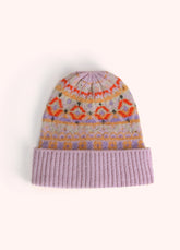 A beanie with a geometric orange, purple and gold pattern on it, against a light background.