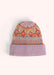A beanie with a geometric orange, purple and gold pattern on it, against a light background.