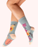 A pair of light blue socks with a colorful floral pattern, against a white background.