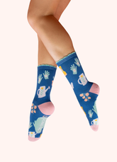 Blue socks with a gardening glove, watering can, and plant pattern. 