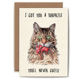 Card with an illustration of a cat with a mouse wrapped in wrapping paper and text 'I got you a surprise. You'll never guess!' on a beige background.