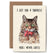 Card with an illustration of a cat with a mouse wrapped in wrapping paper and text 'I got you a surprise. You'll never guess!' on a beige background.
