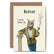 A greeting card with an illustration of a bobcat wearing a gold and black robe, holding a pipe in one hand, and leaning against a white pillar. The text on the card reads "Bobcat. I prefer Robert Cat."