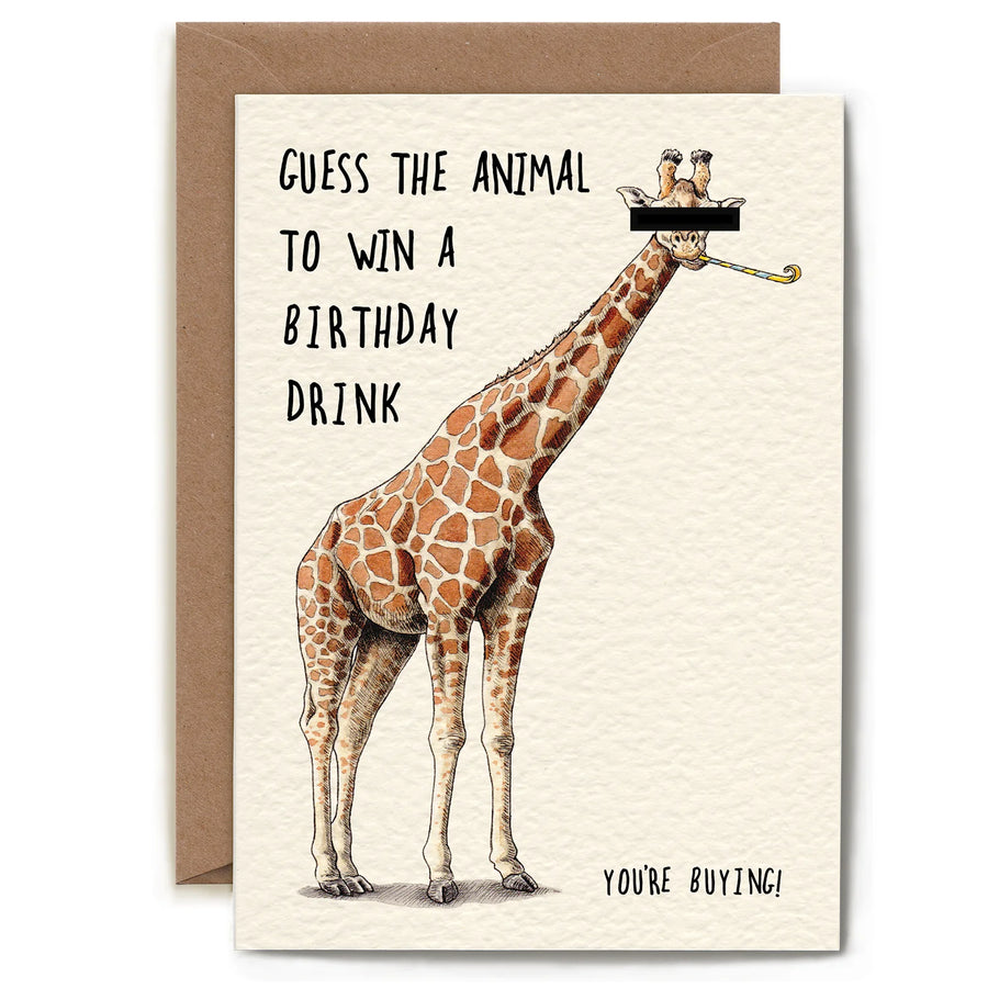 A greeting card with a brown envelope behind it. The card features an illustration of a giraffe with a black bar covering its eyes, with the text 'GUESS THE ANIMAL TO WIN A BIRTHDAY DRINK' and 'YOURE BUYING!' on an off-white background.