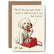 A greeting card with an illustration of a small white dog talking on a red rotary phone. A treat sits broken in half next to the dog, and the text on the card reads "Police? Yes, my owner broke a treat in half and said it was two treats."