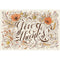Rectangular placemat with brown cursive lettering that rads "Give Thanks", with illustrative florals, leaves, and other fall elements.