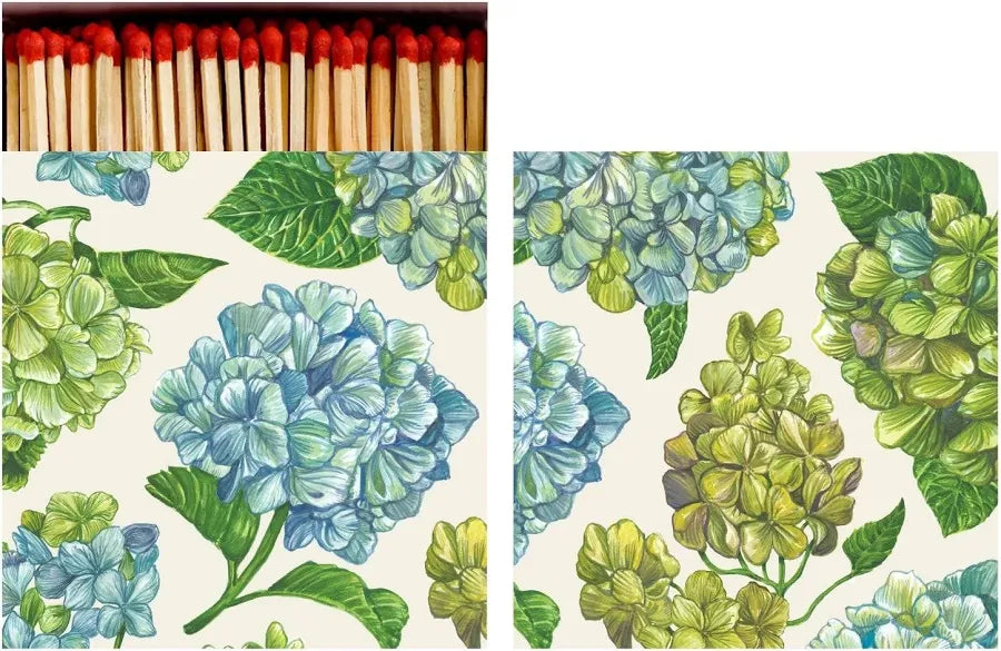 An open matchbook with illustrations of green and blue hydrangeas and matches with red heads poking out of the top. 