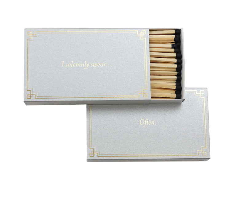 A white matchbox with the saying "I solemnly swear... often."
