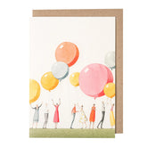 White card with a watercolor painting of people holding large balloons.