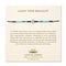 A cream, Cast of Stones-branded backing card holds a crystal-beaded bracelet labelled "Lucky Star Bracelet". There is an informational paragraph below the bracelet.