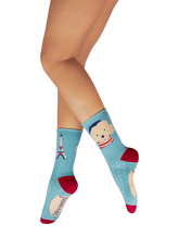 Light blue and red socks with a poodle and Eiffel Tower on each sock.