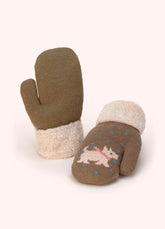 Pair of light brown knitted children's mittens with white westies and blue polka dots, on a white background.