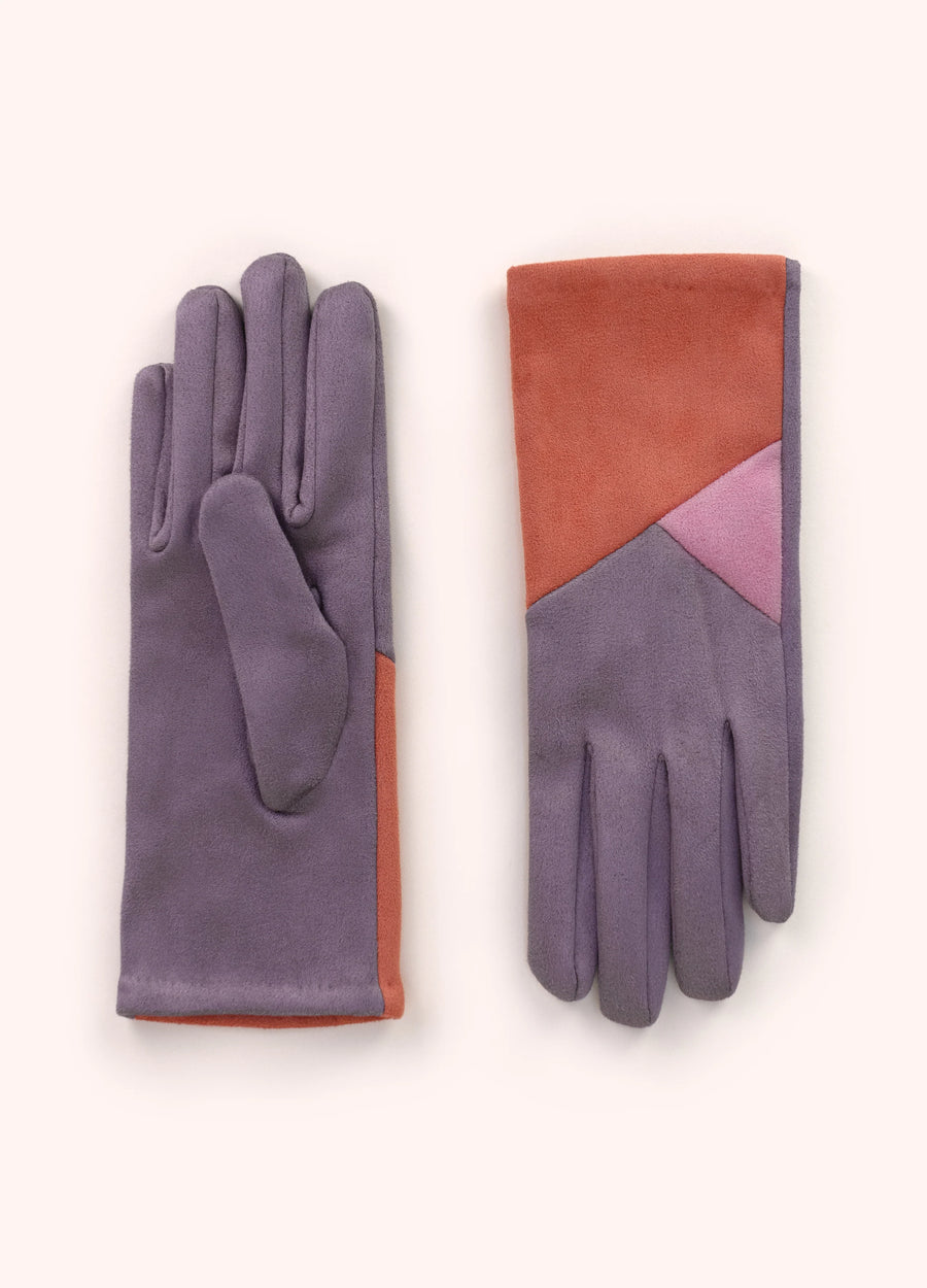 A pair of velvet gloves with a purple and tanorange geometric design on them.