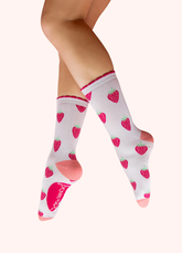 Cream and pink colored socks with a strawberry pattern, against a white background.