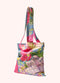 A colorful floral print fabric tote bag, shown against a white background.