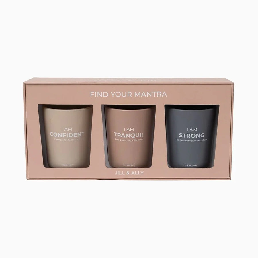 A rose gold box with three votives with the text "Find Your Mantra". The votives are named, respectively, "I am confident", "I am tranquil", and "I am strong".