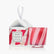 A red and white striped tea light candle sits next to its accompanying box with an ornament string on it, against a white background.